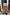 Thumbnail for Tan Trench Coat with Gold Studs shown from behind, featuring a storm flap and belted waist in a street setting.