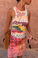 Pastel Morocco Rib Tank Top with sun and eye motifs, styled with a brown clutch against a terracotta wall.