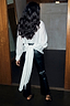 White Studded Tie Back Shirt with silver studs and a long trailing tie, paired with black leather trousers.