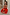 Thumbnail for Red Tomato Lola Mid-axi Dress featuring a ruched strapless bodice and full cotton skirt, styled with a beaded bag.