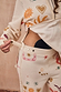 Cream Sundazed Accessible Joggers featuring side zips and poppers for treatment access and iconic prints.