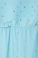 Turquoise Tilly Dress detail highlighting the light blue plisse fabric with gold flecks and elasticated waistband.