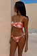 Orange Sun Twist Bandeau Bikini Top featuring white sun motifs and a twist front, perfect for vacation styling.