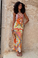 Dolce Vita Valeria slip midi dress with sun motifs and patchwork panels in orange, blue and pink tones.