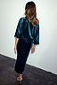 Emerald Velvet Tilly Dress with sparkling dots, an off-the-shoulder neckline and voluminous sleeves, back view.