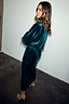 Emerald Velvet Tilly Dress with sparkly silver dots, a voluminous top and fitted skirt on a model.