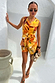 Verano Tate Shorts and matching waistcoat in a yellow and orange tropical palm print for a vacation look.