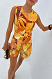 Verano Tate Shorts and waistcoat co-ord in a tropical palm and sun print cotton-linen blend for vacations.