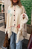 Thumbnail for Cream Western Knitted Cape featuring colourful western motifs and fringe detailing, styled with denim jeans.
