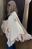 Western Knitted Cape in cream with red western motifs and fringe detailing in a heavyweight knit.