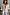 Thumbnail for Oversized White Miley Shirt featuring contrast tortoise buttons and rolled sleeves on a model.
