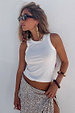 White Ribbed Tank wardrobe staple paired with a silver sequinned skirt and sunglasses for a vacation look.
