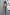 Thumbnail for White Ribbed Tank with an embroidered logo, styled with a silver sequin wrap skirt and sunglasses for a vacation look.