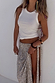 White Ribbed Tank styled with a silver sequinned maxi skirt and high leg slit for a vacation look.