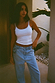 Thumbnail for White Teddy Vest featuring mesh trim detailing, styled with light-wash blue denim jeans.