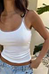 White Teddy Vest with mesh trim at the neckline and armholes, styled with light wash denim jeans.