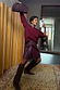 Burgundy vegan leather Mini Kilt Skirt with side pleats and buckles, styled with a jumper in a mirror selfie.