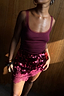 Burgundy Teddy Vest in wine with mesh neckline detailing, paired with a sequinned and lace mini skirt.