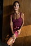 Burgundy Teddy Vest with mesh detailing, styled with a sequinned skirt and delicate lace trim.