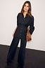 Thumbnail for Black Zoe Shirt with a waist seam and button-down front, paired with black wide-leg trousers and a brown bag.