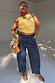 Blue Studded Barrel Jeans with side stud detailing and a barrel silhouette, styled with a yellow top.