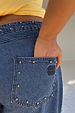 Blue Studded Barrel Jeans detail showing silver studs on the waistband and back pocket with the NFD logo.