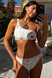 Cream Palma high waist bikini bottoms with orange crochet trim and illustrative print, worn with a one-shoulder top.