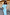 Thumbnail for Blue Chiffon Tilly Dress with an off-the-shoulder chiffon top and satin skirt, against a rustic wooden wall.