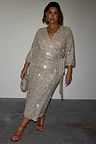 Silver Sequin Kira Wrap Dress with a wrap tie waist and mid-length sleeves, showcasing inclusive sizing.