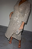 Silver Sequin Kira Wrap Dress with long sleeves and matching clutch bag, highlighting inclusive sizing in UK size 18.
