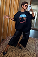Black Fruit Shop Sweatshirt with a colourful graphic, styled with culottes on a model who is 5ft5 and wears size M.