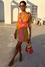Abstract Beaded Fringe Bag with multicoloured glass beads and pink tassels, styled with a matching NFD print mini dress.