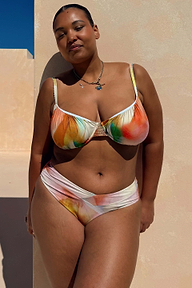 Abstract V Front Bikini Brief in sunset-inspired tones with a soft V-shape waistline, on a model for inclusive sizing.