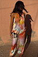Abstract Lily multi-wear top in a vibrant multicoloured satin-esque print, styled with a halter-style neckline.