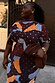 Mara Abstract Tilly plisse dress in brown with metallic gold brushstrokes, shown for inclusive sizing on an XXL model.