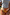 Thumbnail for Abstract V Front Bikini Brief with sunset-inspired painterly tones and a V-shape waistline at the beach.