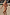 Thumbnail for Abstract Ruched Bikini Top with painterly sunset tones and gathered cups, worn on a sandy beach.
