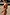 Thumbnail for Abstract Ruched Bikini Top in sunset tones with painterly brushstroke details, styled on a model at the beach.