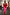 Thumbnail for Red and pink Afia midi dress with a multi-wear wrap tie waist and off-the-shoulder style in a mirror selfie.