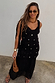 Black Alicia Dress featuring a crochet bodice with silver sequins and a gathered chiffon skirt on a model.