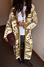 Olive Amara Knit Coatigan featuring cream heart and eye motifs in an oversized longline silhouette.