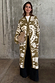 Olive Amara Knit Coatigan featuring cream eye and heart motifs, styled with black wide-leg trousers.