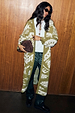 Olive Amara Knit Coatigan featuring cream heart and eye motifs in a longline, oversized silhouette.