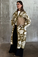 Olive Amara Knit Coatigan with cream hand-painted motifs, paired with black wide-leg trousers.
