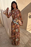 Star Fawn Aria Mesh Dress with a brown fawn spot print, celestial motifs and flared sleeves in a sunlit setting.
