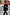 Thumbnail for Black oversized sweatshirt with ecru embroidery, styled in a London street setting with a red double-decker bus.