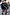 Thumbnail for Black Sweatshirt with ecru sleeve motifs, styled in a London street scene highlighting inclusive sizing.