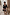 Thumbnail for Black Miley Shirt with blouson sleeves and tortoise buttons, styled with lace-trim leopard print shorts in a patio.