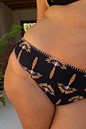 Black Palm Embroidered High Leg Brief with pink crochet trim and palm embroidery, highlighting inclusive sizing.