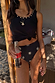 Black Studded Rib Vest with gold neckline studs, tied over printed swimwear for a vacation look.